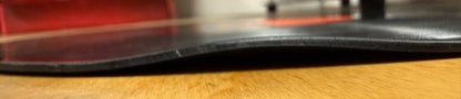BEFORE - Close-up of a vinyl record with a a sharp bend at the edge 10mm lift